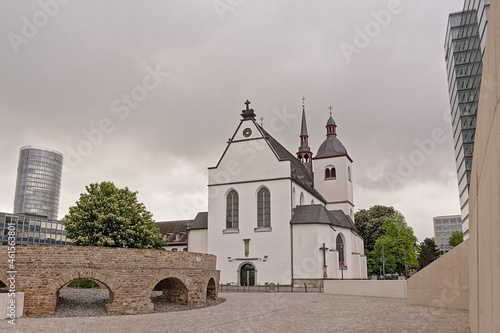 Alt Saint Heribert church, and modern office building in Cologne. photo