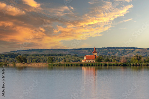 Nove mlyny reservoir and in the background the flooded church of St. Linhart and Palava with the ruins Divci Hrady in the Czech Republic.