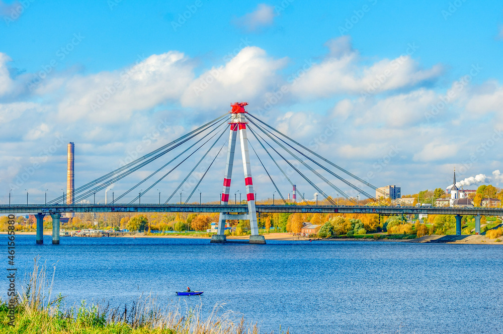 Fototapeta premium The first cable-stayed bridge in Russia across the Sheksna River in Cherepovets. City landscape on a sunny day.