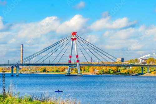 The first cable-stayed bridge in Russia across the Sheksna River in Cherepovets. City landscape on a sunny day.
