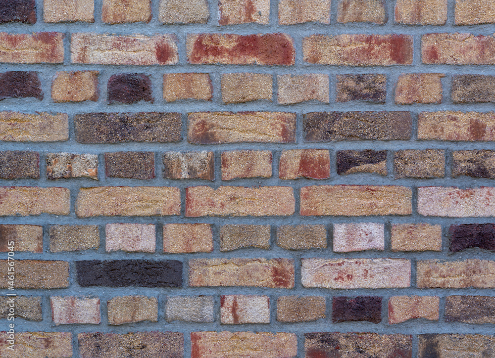 Fototapeta premium Colorful clinker brick wall with different stones, top view, texture Background wallpaper