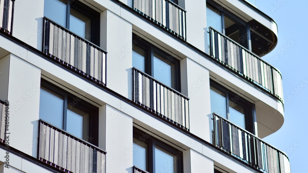 Modern apartment building. Modern urban architecture and details of building facade. Sunlight. Modern apartment building. Modern urban architecture and details of building facade. Sunlight.