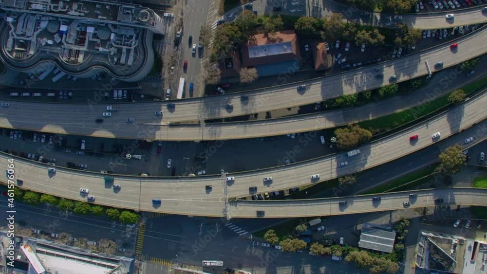 Slow Motion Overhead View Of Elevated Highway In San Francisco. Traffic Passing By Freeway During Rush Hour. Several Buildings And Streets Surrounding It. California, United States. Sunny Day. Slow Motion Overhead View Of Elevated Highway In San Francisco. Traffic Passing By Freeway During Rush Hour. Several Buildings And Streets Surrounding It. California, United States. Sunny Day.