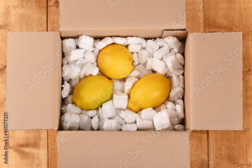 Lemon in a cardboard post box.