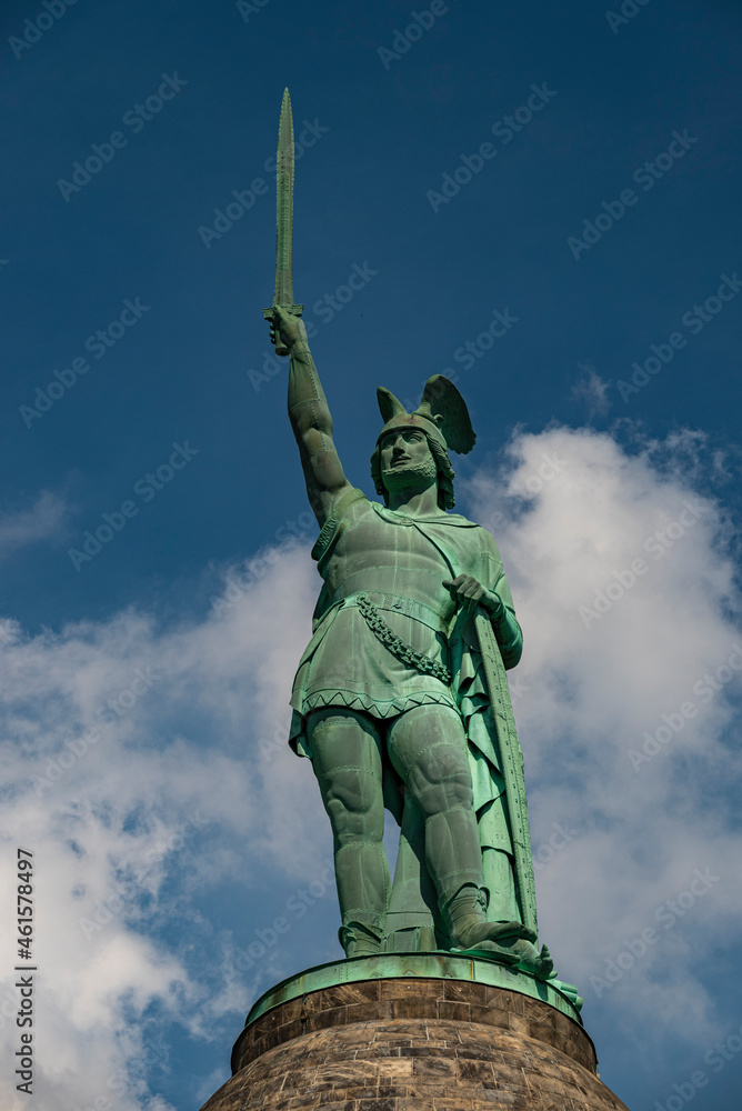 Close up of the famous Hermannsdenkmal (Hermann's Monument) against a cloudy blue sky on the Grotenburg mountain near Detmold, Teutoburg Forest, Germany