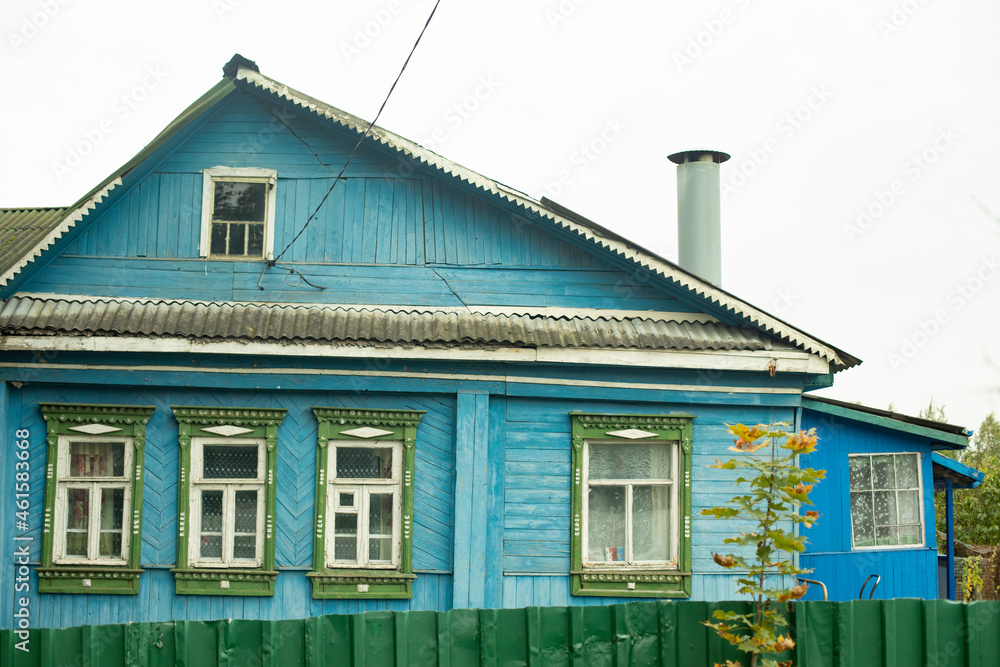 Country house in Russia. Blue wooden house. Rural life. Russian architecture.