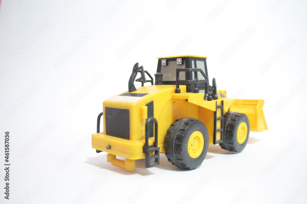 yellow bulldozer isolated on white