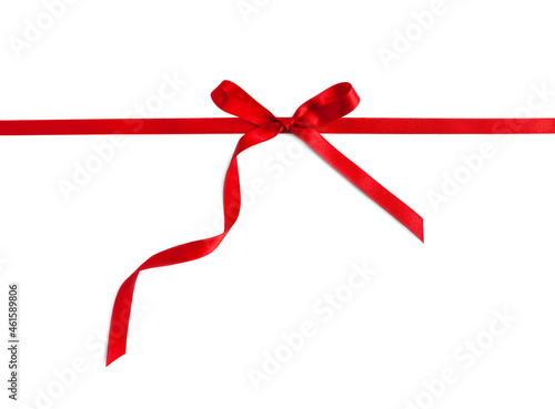 Red elegant gift bow on white. Red horizontal ribbon, curved. 