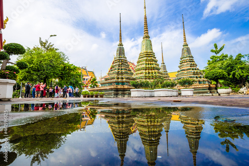 Beautiful pagoda of Wat Pho temple complex against blue sky sightseeing travel in Bangkok photo