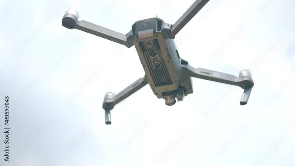 Drone flying low with cloudy sky as background Drone flying low with cloudy sky as background
