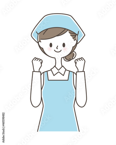 ガッツポーズをする三角巾とエプロンをつけた女性