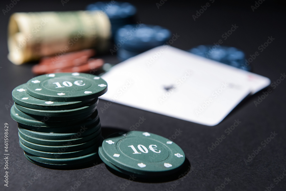 Poker chips on dark background Poker chips on dark background