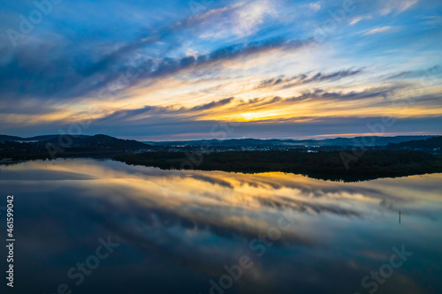 Sunrise and cloud reflections waterscape