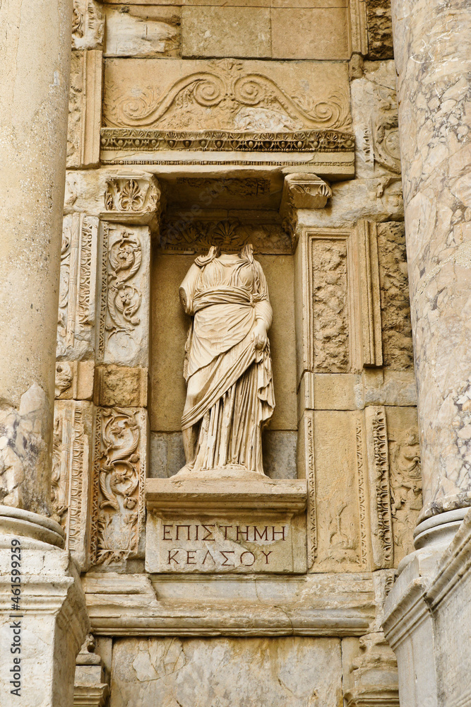 A marble statue of Episteme (Knowledge) stands in a niche of the ruined Roman facade of the Library of Celsus, Ephesus, Turkey