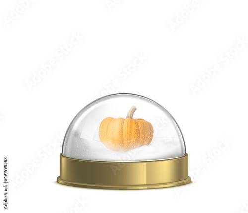 mini pumpkin in snow globe in front of white background
