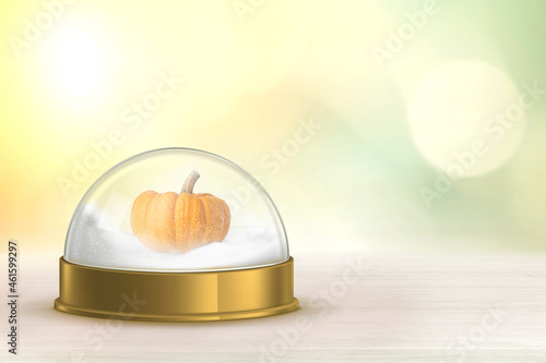 mini pumpkin in snow globe Beige wood floor product background with green bokeh wall