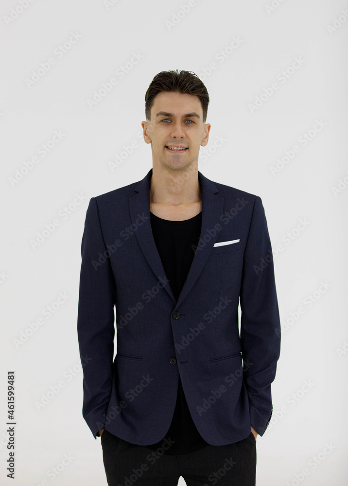 Portrait studio shot of smart handsome confident successful Caucasian male businessman entrepreneur owner or lawyer model in casual business suit standing smiling look at camera on white background Portrait studio shot of smart handsome confident successful Caucasian male businessman entrepreneur owner or lawyer model in casual business suit standing smiling look at camera on white background