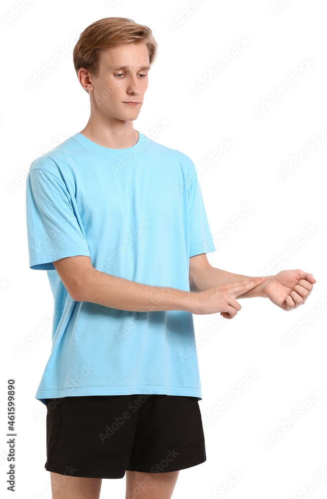 Sporty young man counting pulse on white background Sporty young man counting pulse on white background