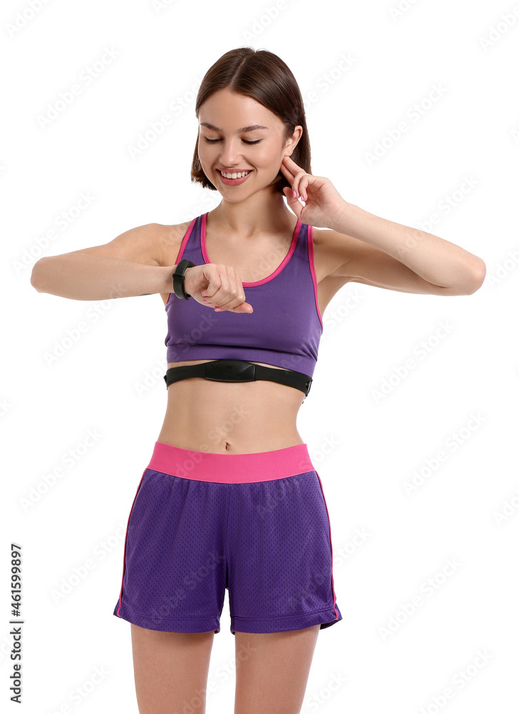 Sporty female runner checking pulse on white background Sporty female runner checking pulse on white background