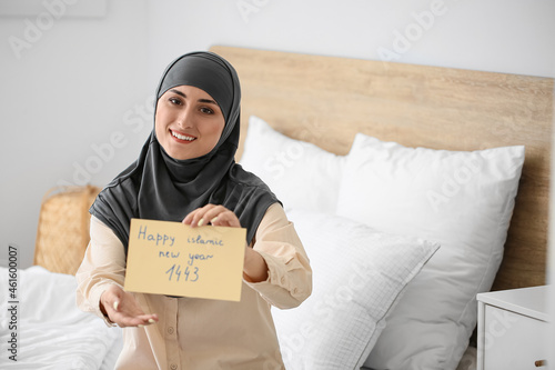 Young Muslim woman with gre...