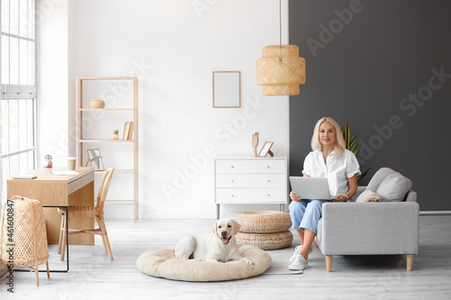 Mature woman with laptop an...
