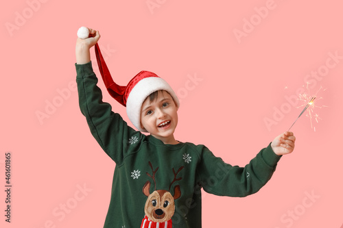 Little boy in Santa hat and...