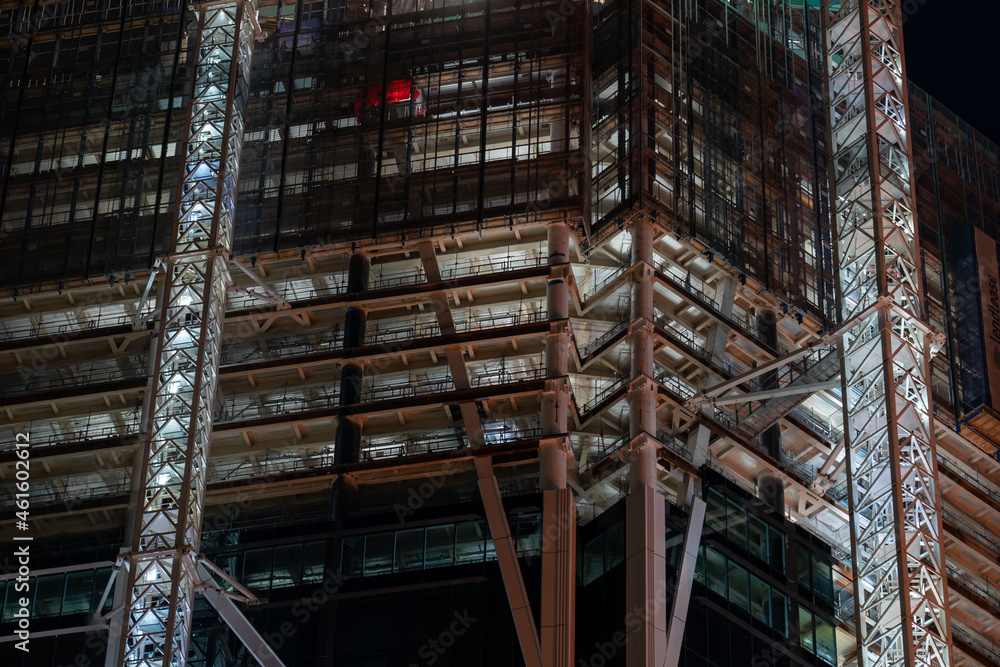 building under construction at night in the city