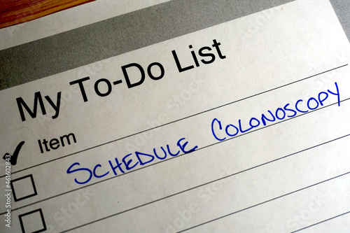 Handwritten reminder on a to do list to schedule a colonoscopy