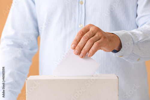 Voting man near ballot box, closeup © Pixel-Shot