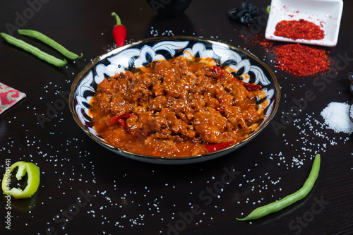 Asian food. Beef in spicy sauce with sesame seeds and chili pepper