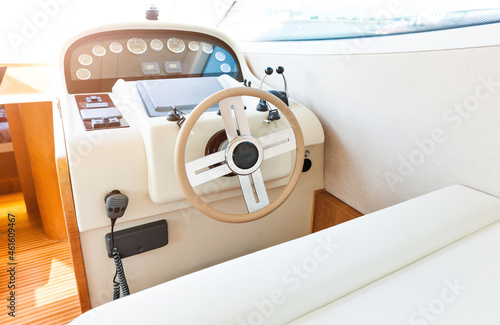 Steering wheel on a yacht cabin photo