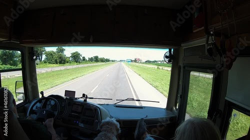 POV of man driving a Class A RV with Wife and dog in RV; on the interstate with frontage road in southern Missouri; concepts of travel, lifestyle and fulltime RVing photo
