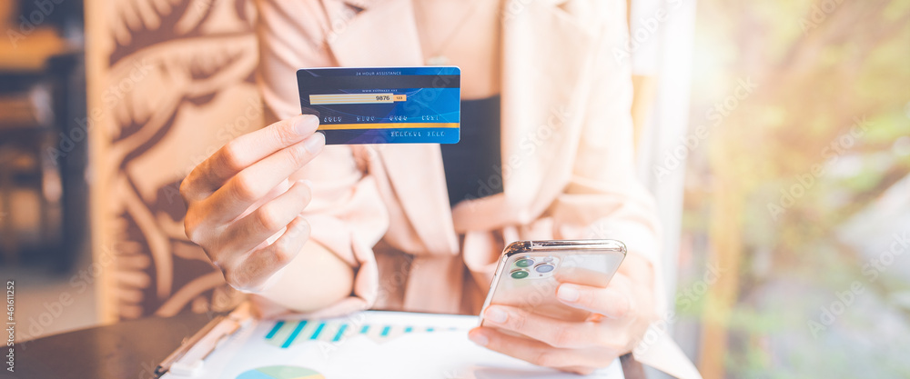 Businessman using credit card and mobile phone online shopping