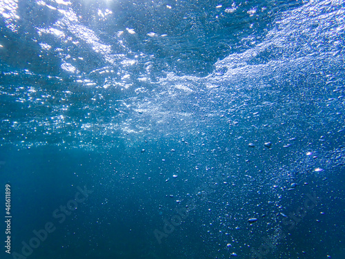 Underwater bubbles with sunlight. Underwater background bubbles, Air bubbles underwater rising to water surface, natural scene, Mediterranean sea, Underwater with bubble. Great for backgrounds. © boulham