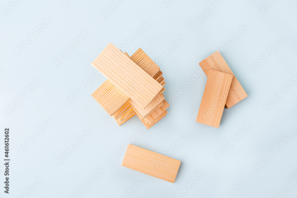 Board game Tower of wooden blocks. Business concept. Activity for strategy, concentration, agility, logic and coordination. Teamwork balancing. Copy space for text. Board game Tower of wooden blocks. Business concept. Activity for strategy, concentration, agility, logic and coordination. Teamwork balancing. Copy space for text.