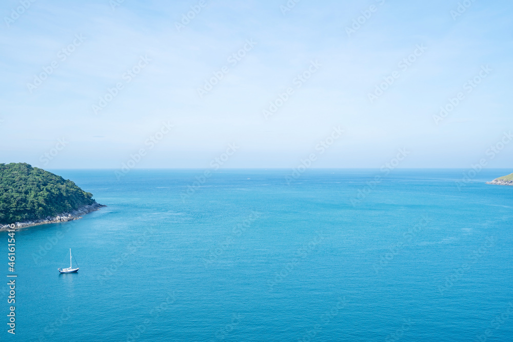 Tropical rippled and calm sea with small islands on the horizon and white fluffy clouds Sea surface space area