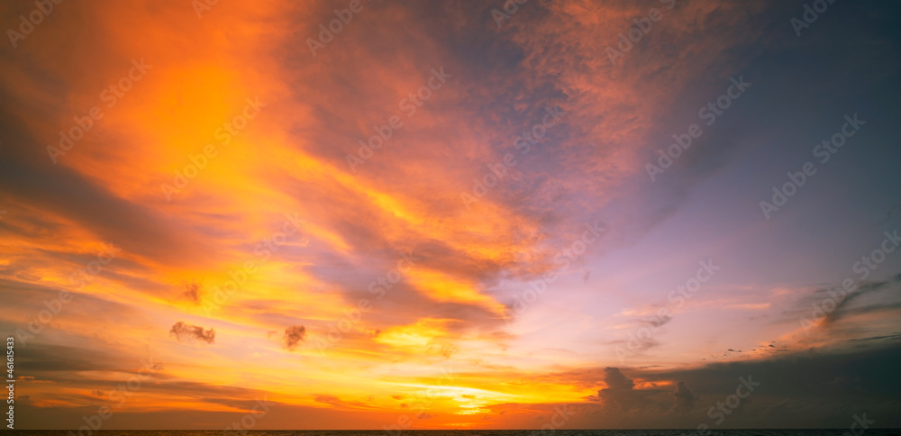 Amazing seascape with sunset clouds over the sea with dramatic sky sunset or sunrise Beautiful nature minimalist background and texture Panoramic nature view landscape Dramatic light sky and clouds