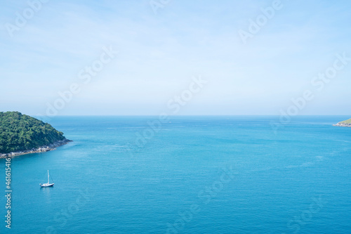 Tropical rippled and calm sea with small islands on the horizon and white fluffy clouds Sea surface space area