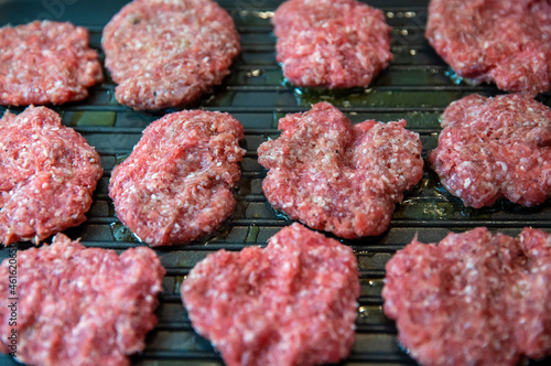 Frying four round beef meat for hamburger