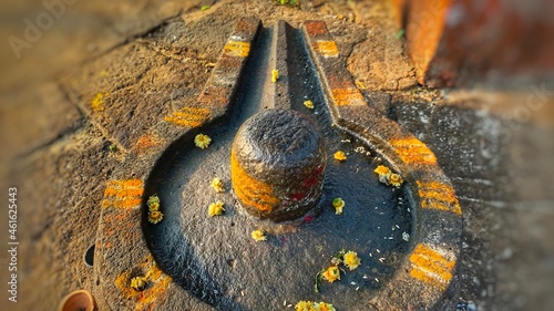 Hindu people offer prayers to shiv linga,symbolic form of God Shiva near Panchaganga Ghat, Kolhapur,India
