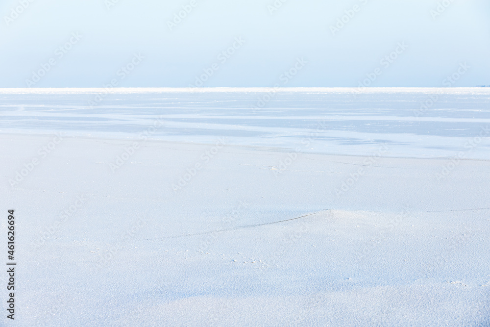 Empty winter landscape. White snow on frozen Baltic Sea