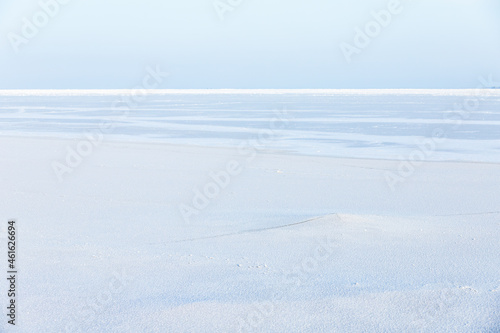 Empty winter landscape. White snow on frozen Baltic Sea