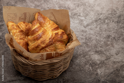 Homemade fresh croissants on texture background