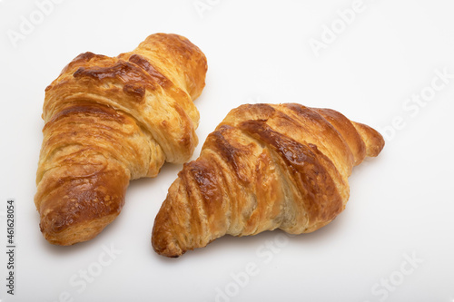 Homemade fresh croissants on white background