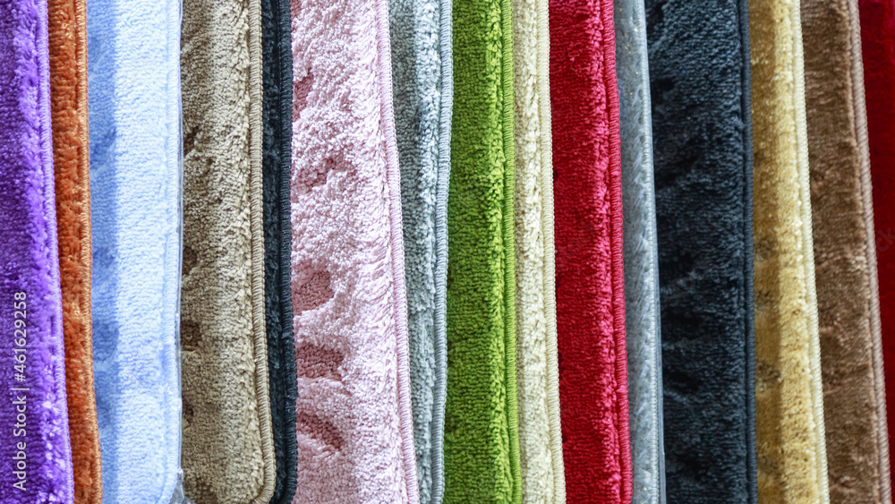 Textile background with texture, variation of multicolored soft pile carpets