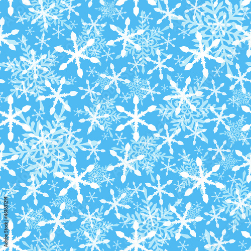 Snowflakes falling seamless pattern on blue background