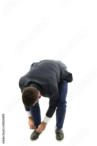 Businessman tie shoelaces, isolated on white background