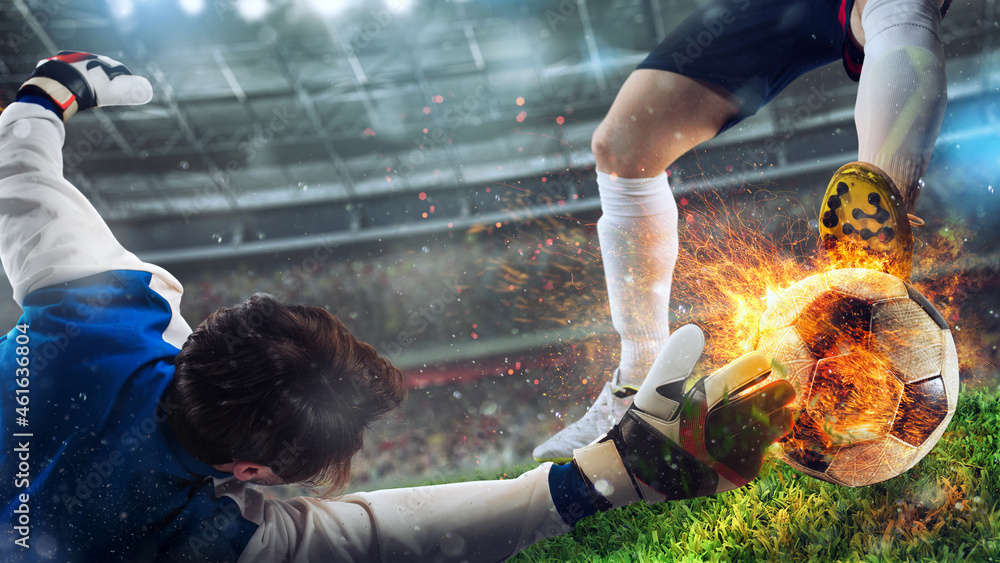 Goalkeeper tries to catch a fiery soccer ball - obrazy, fototapety, plakaty 