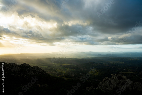 View from above, stunning view of a grasslands surrounded by a mountain range during a beautiful sunrise. Panoramic view from Monte Pino, (Vedetta Monte Pino) Sardinia, Italy.