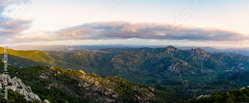 View from above  stunning landscape with a mountain range and a valley during a beautiful sunrise. Panoramic view from Monte Pino   Vedetta Monte Pino  Sardinia  Italy.